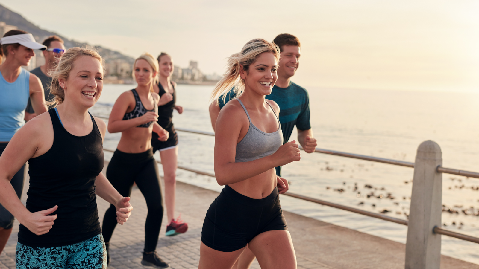 Happy group of people running