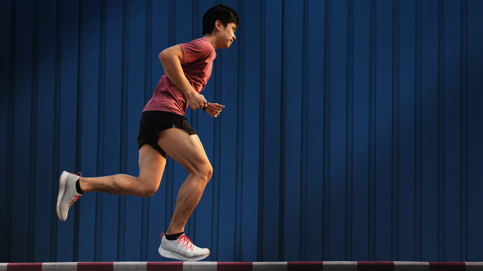 Man running, landing softly on his foot