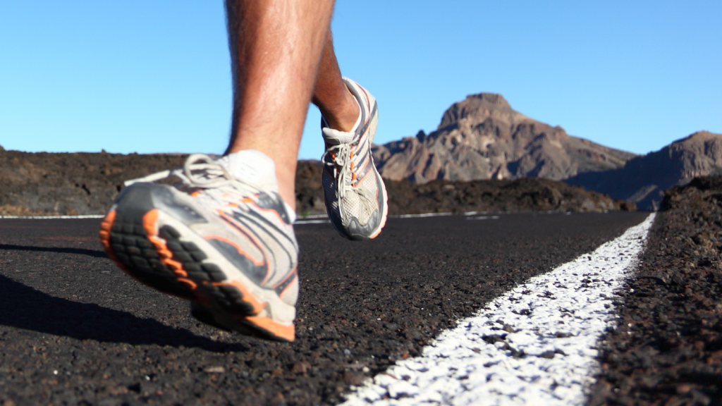 Man running in tough terrain in durable running shoes