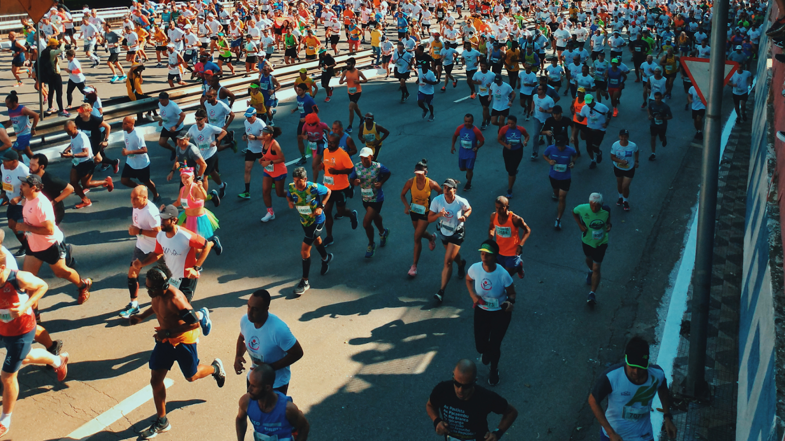 Group of people running a race at different running paces