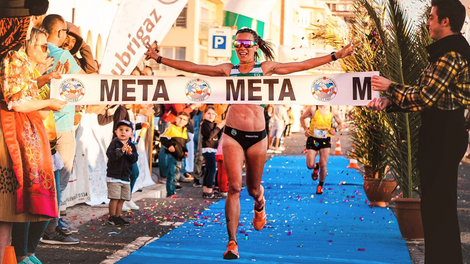 Woman completing a race, crossing the finish line