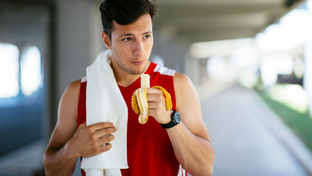 Man eating a banana after his run