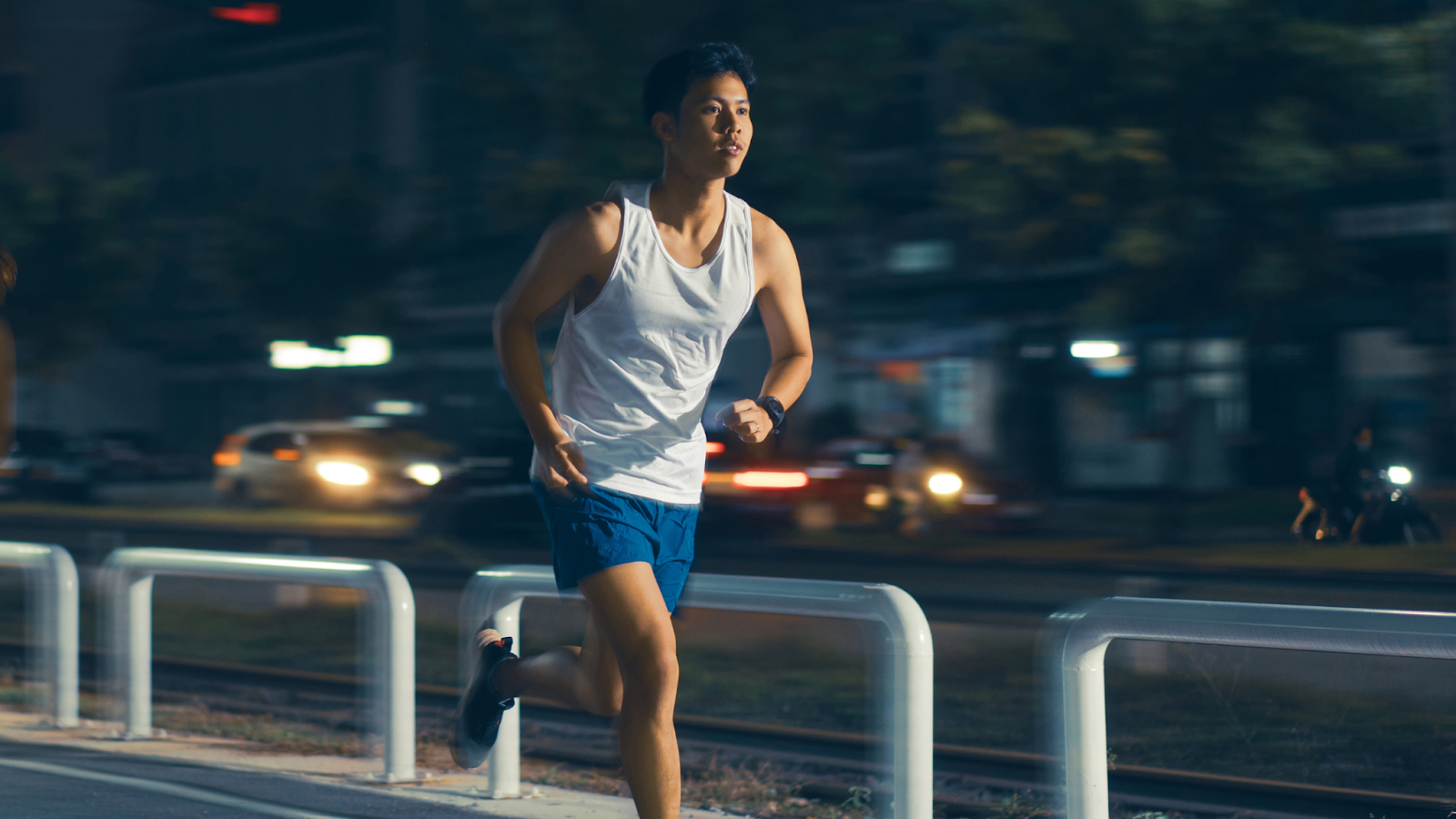 Man running at night in a city