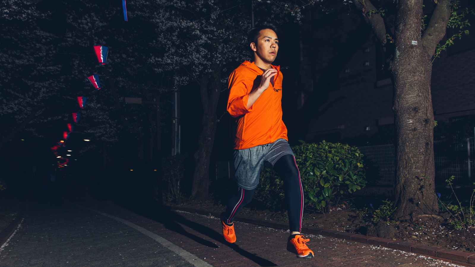 Man running at night with bright clothes