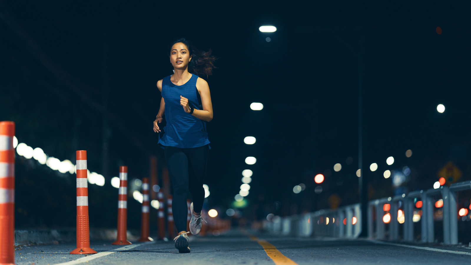 Woman running at night