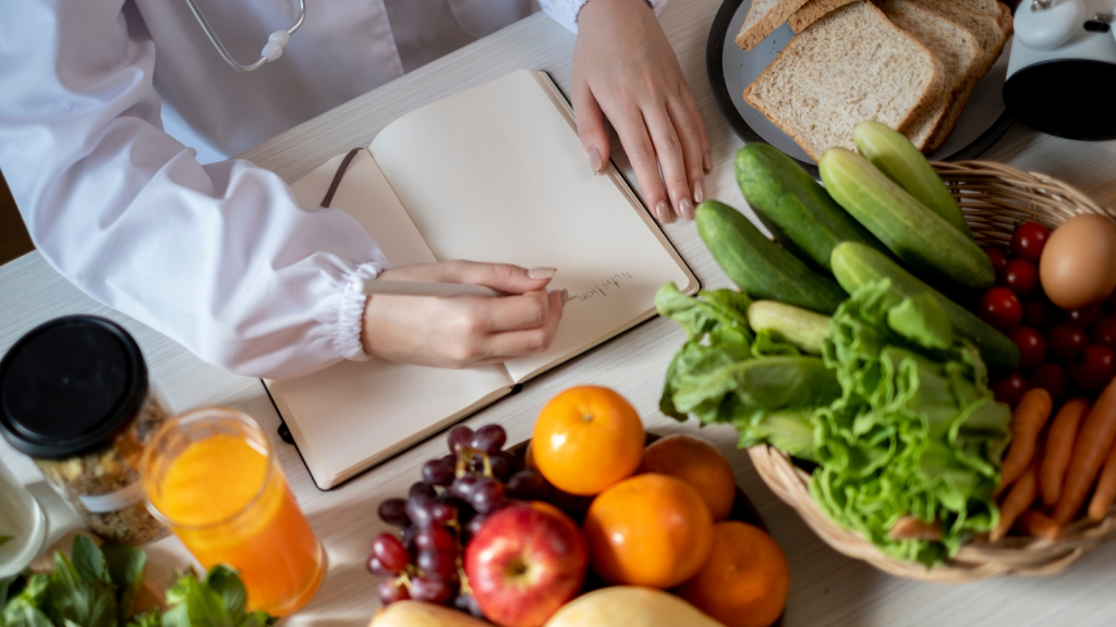 Woman writing out her nutrition plan to compliment her running plan to lose weight