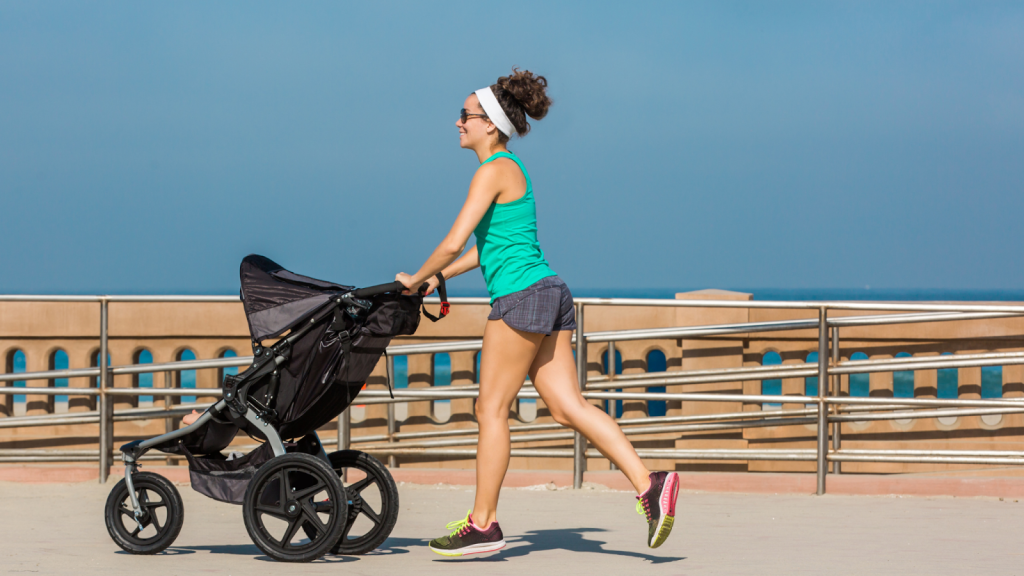 Woman running with her baby in a stroller