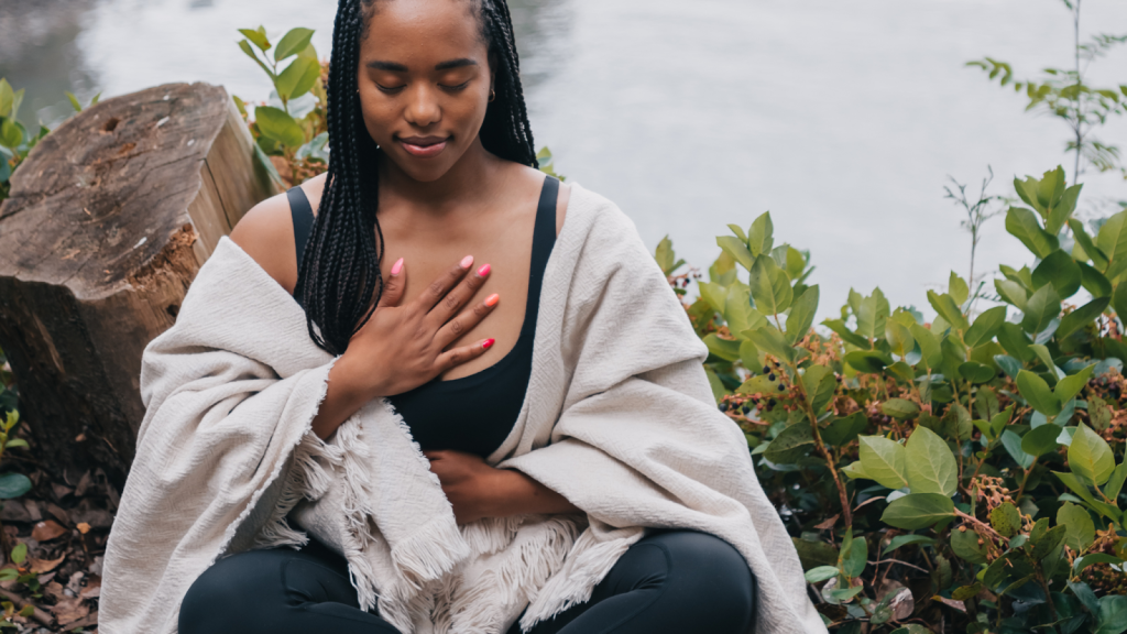 New mum meditating outside