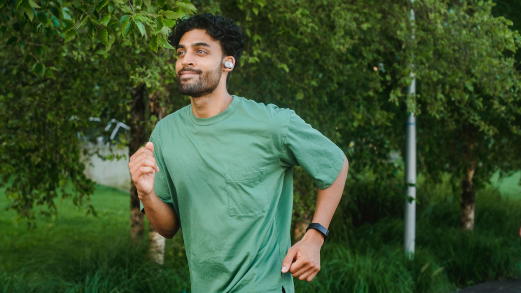 Man happy running outside, maintaining a breathing pattern