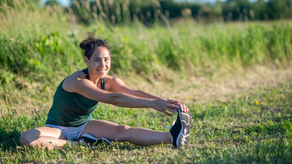 Woman stretching her legs after a run