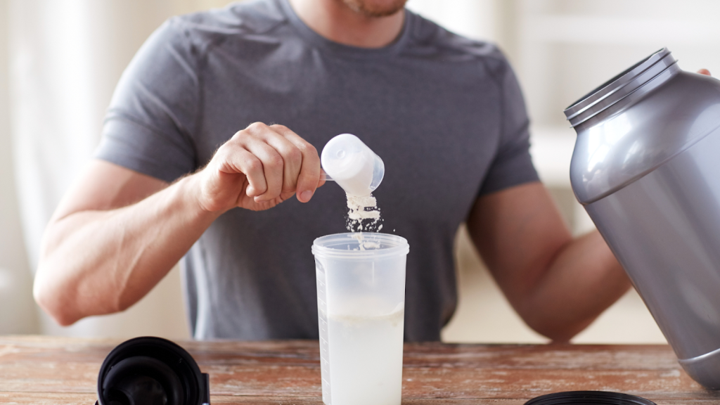 Man preparing a drink with creatine before his workout